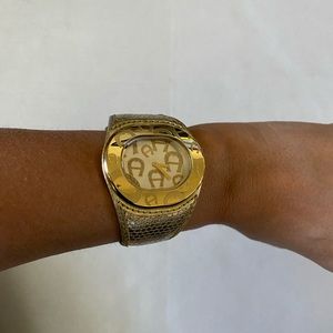 Etienne Aigner gold leather watch
